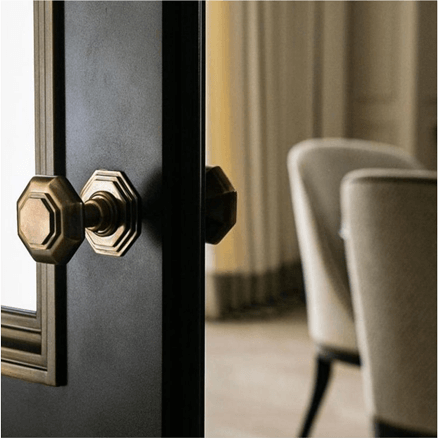 Faceted door knob on a dark door