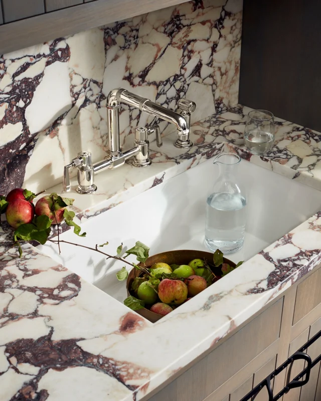 An expression of enduring design. @waterworks R.W. Atlas faucet, Clayburn sink, Bridle metalwork cabinetry, and Keystone marble in Plumeria, come together beautifully through craftsmanship and material integrity.

#waterworkskitchen #alexandermarchant #bathdesign