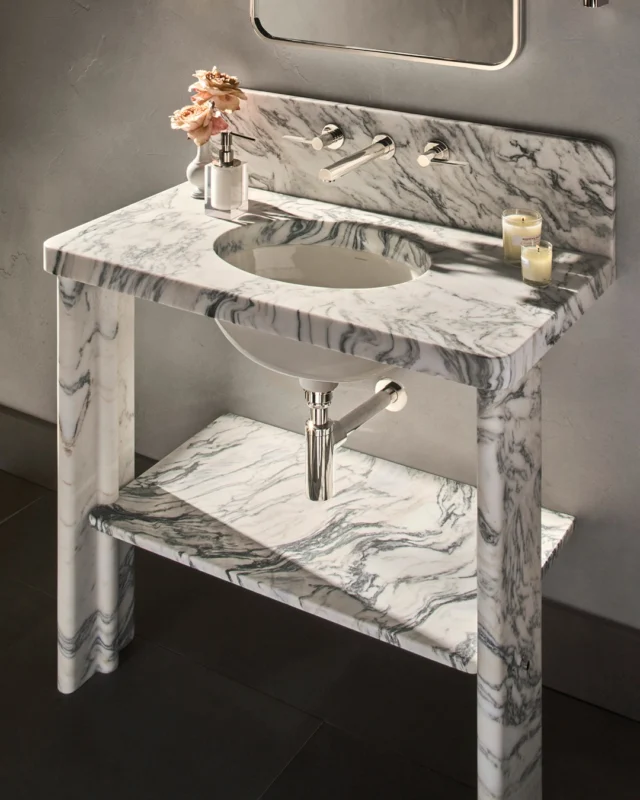 The new Valor washstand by Waterworks redefines modern minimalism through sculptural form and thoughtful craftsmanship. Carved from a single block of Fantastico marble, every detail, from the integrated legs and shelf to the backsplash and refined brass pin accents, feels seamless, intentional, and timeless. 

Featuring the new Waterworks Cut with a 5 cm counter surface.

@waterworks #waterworks #marbledesign #theperfectbath